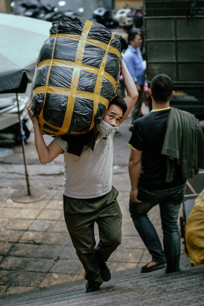 Heavy item handling is a moving service category used for items that are unusually heavy, awkward, difficult to grip, or difficult to route safely through the property. In practice, the challenge is not only the item’s weight; it is also its shape, balance, carry position, route difficulty, and how often it must be lifted or repositioned. NIOSH’s lifting guidance and OSHA’s materials-handling publications both emphasize that lifting risk depends on task design and body position, not just the number on the scale.  What counts as a heavy item  In home moving, heavy items often include:  safes gym equipment large appliances stone or marble furniture oversized sofas solid wood cabinets vending machines commercial equipment some pianos packed cartons with dense contents such as books, tools, or records  Your survey’s “heavy handling above 25 kg” field is useful because it gives the operations team an early signal that normal handling assumptions may not be enough.  Why heavy handling changes the job  A move with several heavy items may require:  more crew members lifting aids or dollies route protection slower working speed more time for dismantling or reassembly separate scheduling extra risk controls for stairs, narrow turns, or long carry distances  OSHA notes that proper work practices, equipment, and controls are essential to reduce accidents in moving and storing materials. NIOSH likewise uses variables such as horizontal reach, vertical position, frequency, and travel distance when evaluating lifting risk. That is exactly why two items with similar weight can have very different handling difficulty and cost.  Weight is only one part of the problem  Customers often assume heavy means “anything very heavy.” Operationally, that is incomplete. An item can be difficult because it is:  bulky top-heavy fragile slippery hard to grip impossible to keep close to the body dangerous to rotate on stairs hard to load without tilt or impact  OSHA specifically warns that reaching, bending, and carrying awkward loads in one-sided or off-center positions increases strain and injury risk. That is why a relatively smaller awkward object can sometimes be harder to move safely than a larger item with good handholds and a straight route.  Common situations that increase difficulty  Heavy item handling becomes more complex when there is:  no elevator narrow staircase sharp turn on landing uneven outdoor access long hand carry distance restricted parking insufficient loading space the need for an external lift the need to dismantle doors or furniture sensitive flooring or wall finishes  These factors matter because the safer the route, the more controlled the lift. The worse the route, the more labor and planning are needed.  Why you should declare heavy items in advance  If heavy or awkward items are not declared, a moving team may arrive with the wrong crew size, wrong equipment, or the wrong vehicle setup. That can cause delays, rescheduling, or unsafe on-site improvisation. From a risk perspective, the problem is predictable: both OSHA and NIOSH treat manual handling as something that should be assessed and controlled before the task, not discovered halfway through it.  What affects the cost of heavy item handling  The main pricing factors are:  actual or estimated weight dimensions grip and balance whether it can be dismantled whether stairs are involved whether a service lift is usable carry distance route complexity need for special equipment risk of surface damage or access damage need for extra packing or crating What to include in your survey  To quote heavy items accurately, ask for:  item type approximate weight if known dimensions whether it can be dismantled origin and destination floors elevator details stair details hand carry distance photos if possible